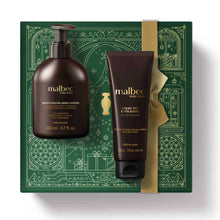 Kit de Natal Malbec Pure Gold do oBoticário — caixa verde com laço dourado e dois frascos dourados Malbec Pure Gold, um creme e uma loção hidratante.