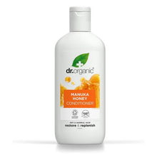 Frasco branco translúcido de 265 ml de Amaciador Mel de Manuka Bio Dr. Organic, com tampa transparente e rótulo laranja com imagem de favos de mel.