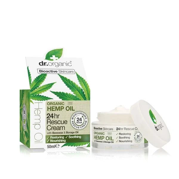 Creme hidratante facial 24h com óleo de cânhamo biológico, em boião branco de 50 ml aberto, ao lado da embalagem verde e branca.