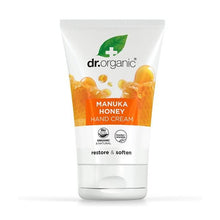 Creme para Mãos e Unhas Mel de Manuka Bio Dr. Organic, em bisnaga branca de 125 ml com embalagem de cartão branca e laranja.