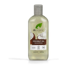 Frasco transparente de Champô Óleo de Coco Virgem Bio Dr. Organic, 265 ml, com tampa branca e líquido amarelo-claro.