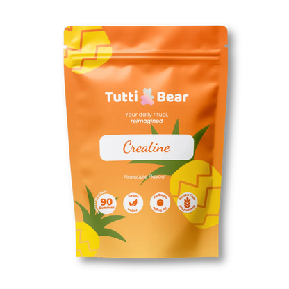 Embalagem flexível vermelha de Gomas de Creatina TuttiBear, sabor a morango, com 90 gomas, apresentada em bolsa com fecho.
