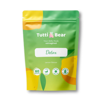 Embalagem flexível verde e amarela de Gomas Detox TuttiBear, sabor a limão, com 60 gomas veganas sem açúcar e sem glúten.