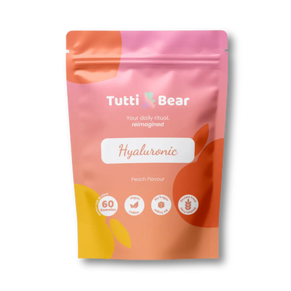 Embalagem rosa e coral de Gomas de Ácido Hialurónico TuttiBear, em bolsa com fecho, sabor a pêssego, 60 gomas.